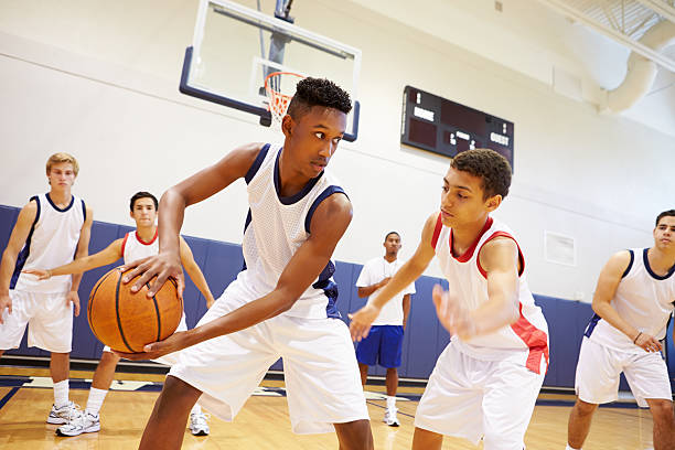 High school basketball players competing during a game