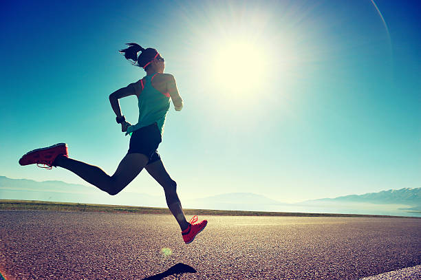 Runner training on a trail at sunrise