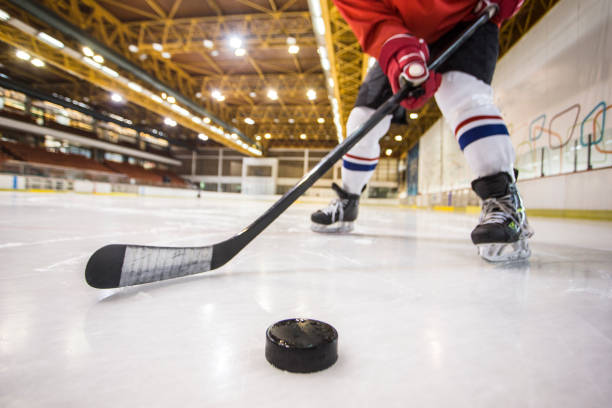 Hockey player handling the puck on the ice
