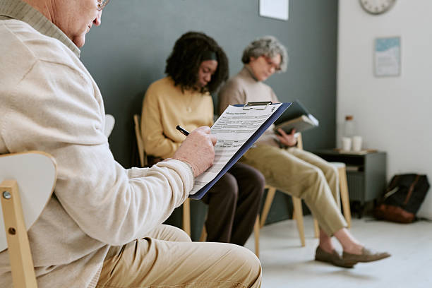 Patient completing an intake form in a therapy waiting room