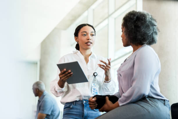 Physical therapist talking with a patient about her care options