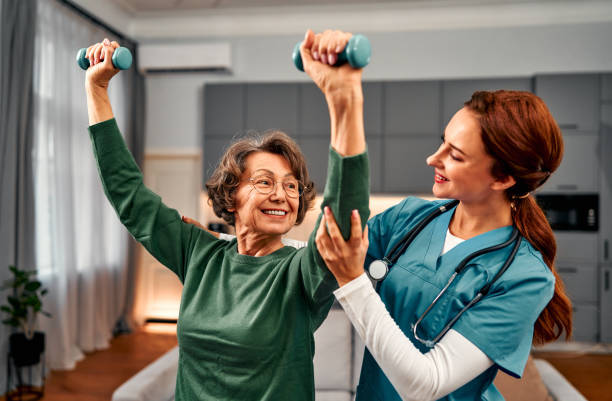 Therapist celebrating progress with a smiling patient