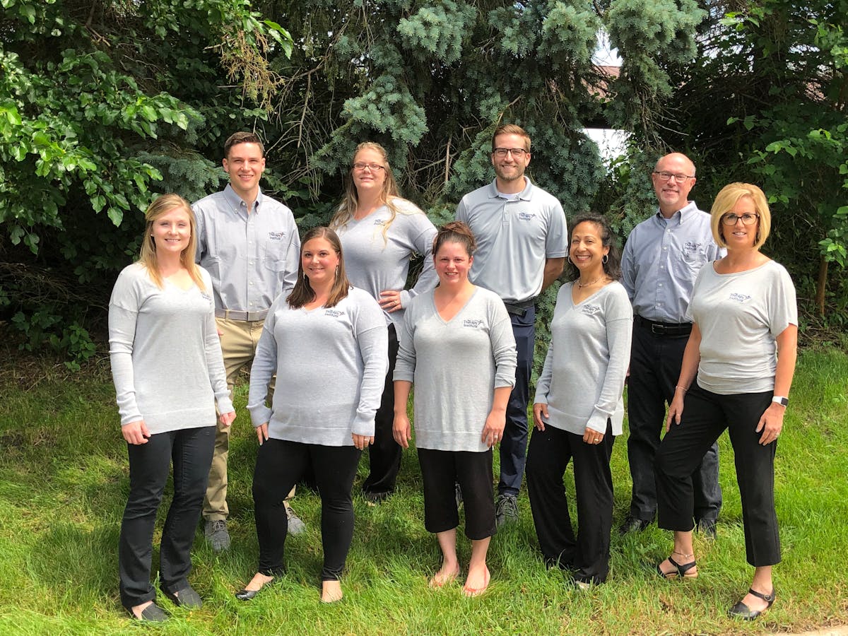 The Therapy Institute team standing together outside the Haslett clinic